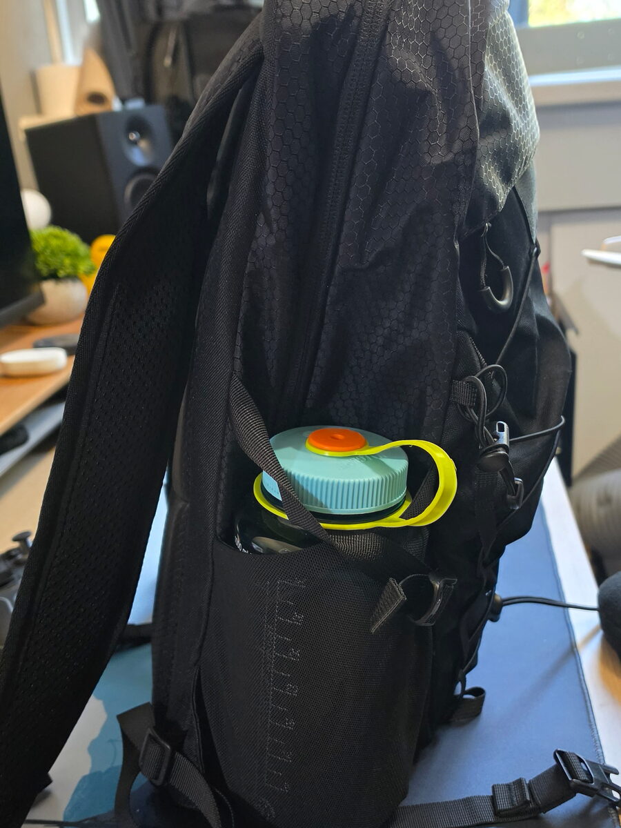 A Nalgene bottle in the stretch side pocket of the WATERFLY 20L