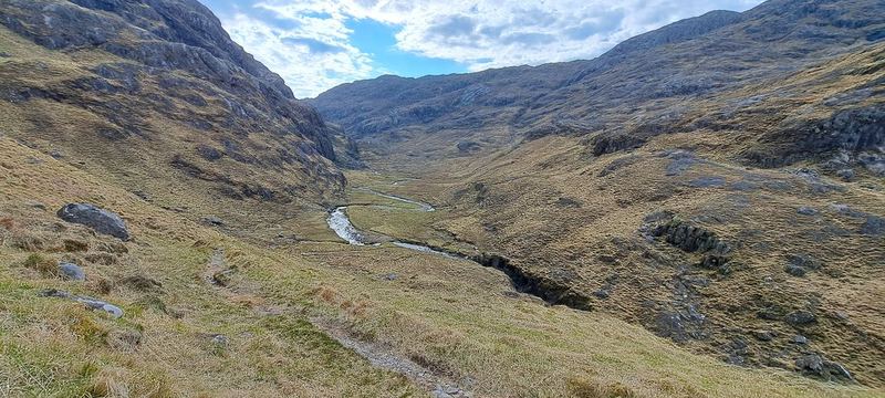 Following a green river valley